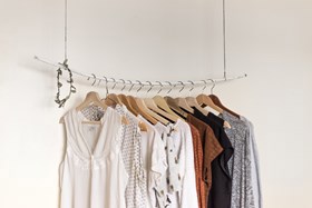 clothes hanging on rail